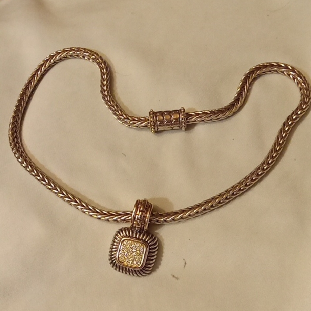 Elegant Silver-Toned Necklace with Intricate Pendant